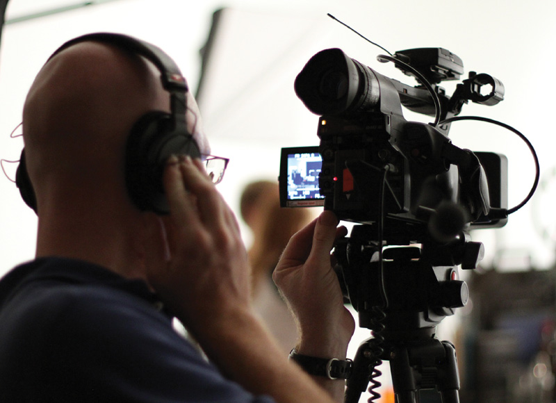 Cameraman Filming On Set